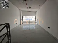 Shop for annual rent in Al Mowaihat 3, Ajman. Mezzanine included, 70 sqm, main road location, free m