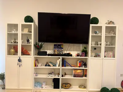 White Entertainment Center with Display Cabinets and Shelving