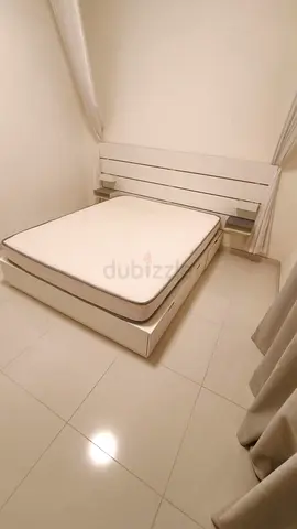 White Double Bed with Integrated Storage and Headboard