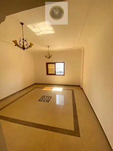One bedroom and a living room in Al Khan, central air conditioning, spacious layout, and a location with easy access to Dubai.