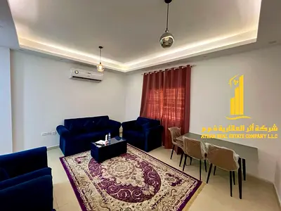 Luxury one-bedroom apartment with a balcony and open views. Ajman Corniche. Fully furnished, available for monthly rent.