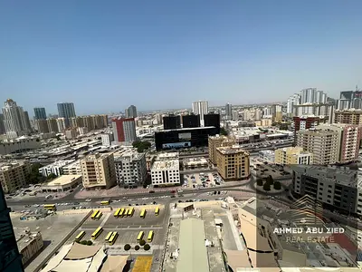 Very large studio for rent in Al Nuaimiya Tower C with central AC, balcony with open view, American kitchen, prime location, close to all services