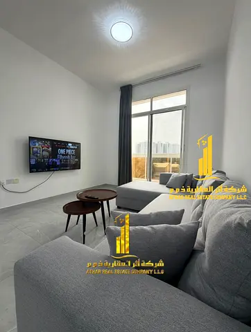 Luxury apartment, brand new, with a spacious one-bedroom apartment and living room with a balcony. Located in Ajman, Al Rashidiya 2