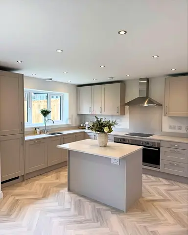 Modern fitted kitchen with island - neutral grey units