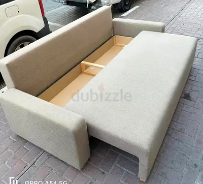Light grey fabric sofa bed with storage - good condition
