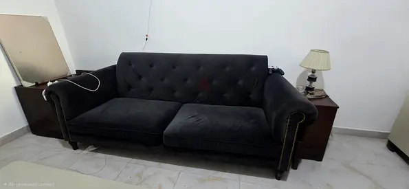 Comfy charcoal grey tufted sofa