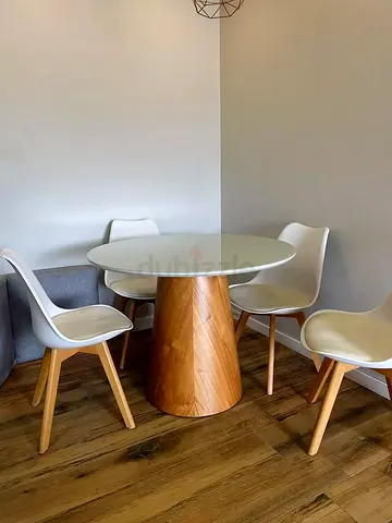 Elegant Solid Dining Table with Round Top and Geometric Base Design