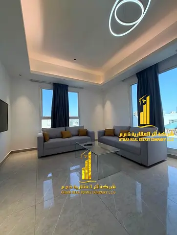 First occupancy, luxurious and elegant two-bedroom apartment with a fully furnished living room, available for monthly rent in Al Rashidiya, next to t