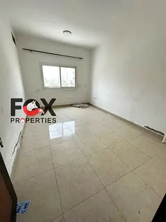 One bedroom and living room for annual rent in Al Rashidiya 3, behind Grand Mall, central air condi