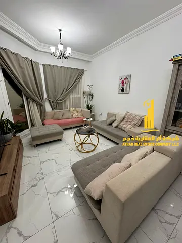 Luxury two-bedroom apartment with a living room and balcony. Ajman, Al Rawda. Fully furnished. For monthly rent.