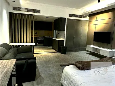 A studio apartment with unique decor and a balcony.