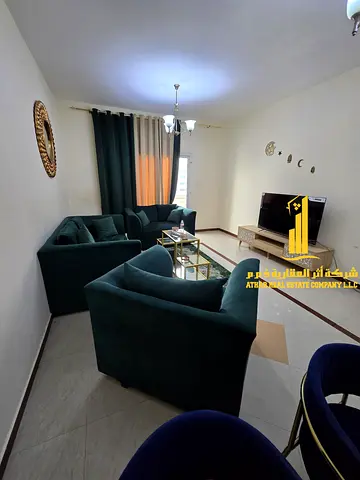 Luxury one-bedroom apartment with a living room and balcony offering an open view. Ajman, Al Nuaimiya. Fully furnished
