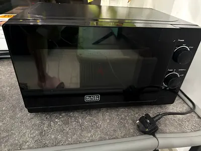 Used microwave oven (interior good condition) - best working condition. With 2 pans free