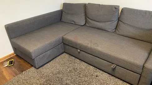Gray L-shaped Sofa bed with Storage — Good Condition