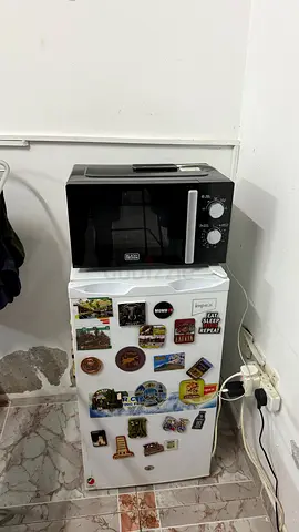 Compact mini fridge with microwave on top - good working condition