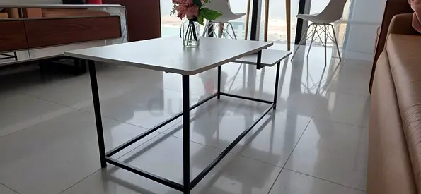 Modern rectangular coffee table with metal frame and laminate top
