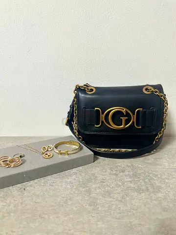 Preloved Authentic Guess Aviana crossbody and gold tone jewelry bundle