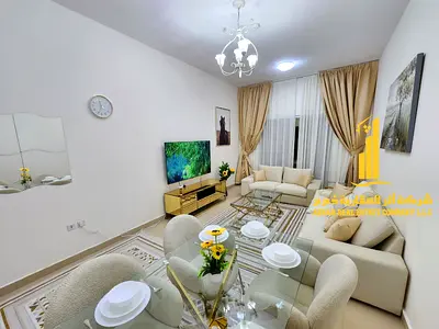 Two-bedroom apartment with a living room, fully furnished with new furniture, available for monthly rent in Ajman - Al Jurf 2 - Al Yasmin Towers