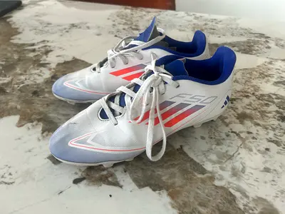 White  Blue Football/Soccer Cleats - Size Unknown, Light Use