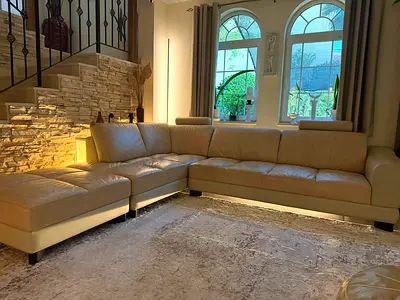 Large L-shaped beige leather sectional sofa with chaise  3mx2.80 m