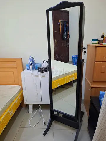 Tall Black Lockable Jewelry Armoire with Mirror and Multiple Compartments