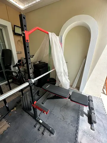 Adjustable weight bench with squat rack and barbell - home gym set