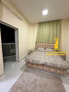 Two-bedroom furnished apartment with a living room for rent in Ajman. Clean and tidy furnishings inc