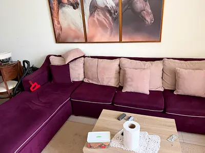 Plum L-shaped Velvet Sofa with Beige Cushions - Good Condition