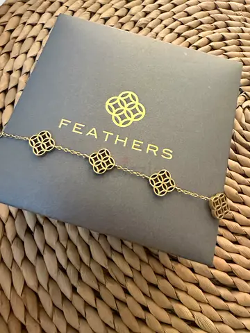 Gold-tone Feathers bracelet with geometric floral motifs