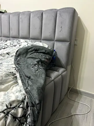 Grey upholstered king-size bed headboard with mattress (used)