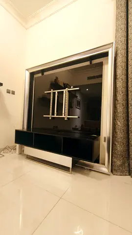 Modern TV Entertainment Center with Glossy Black Finish and Silver Frame