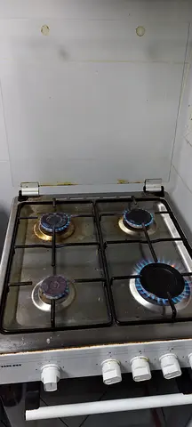 Used 4-Burner Gas Stove with Oven - Functional, Needs Cleaning