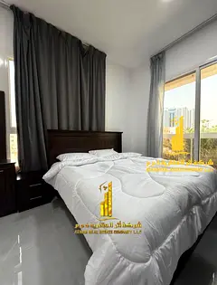For monthly rent in Ajman, two-bedroom apartment with a balcony open view, fully furnished new with