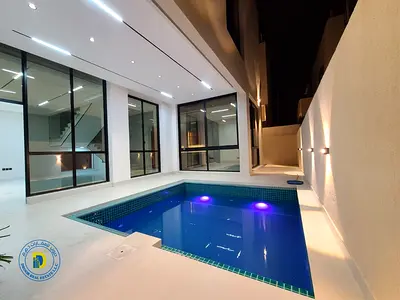 للبيع شامل رسوم التسجيل فيلا 4 غرف مع مسبح وروف بمنطقة الباهية عجمان تشطيب سوبر ديلوكس تملك حر وتمويل بنكى