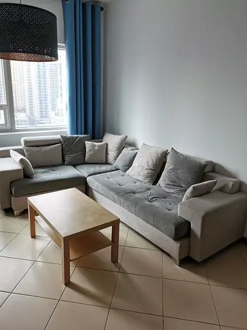 Grey L-Shaped Sofa with Cushions