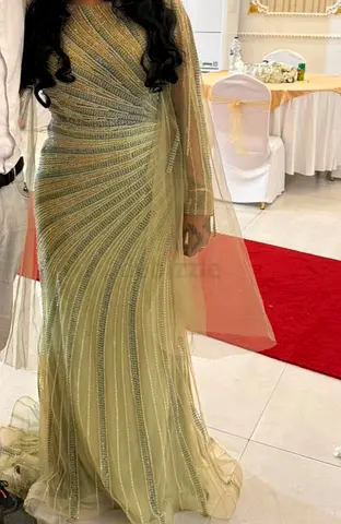 Light green-toned evening gown with embellishments, worn once only.