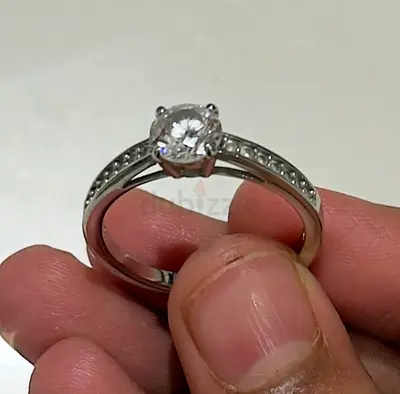 Swarovski Silver solitaire engagement-style ring with channel-set stones new ….100 aed