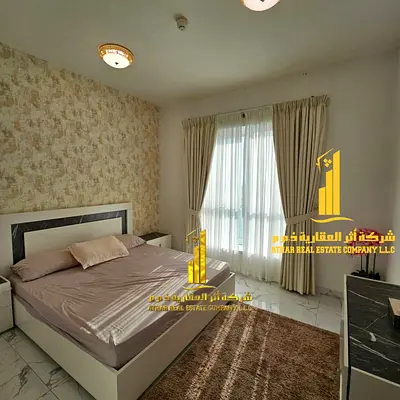 Furnished two-bedroom apartment with a living room for rent in Ajman, Al Rashidiya 1, Oasis Towers. Clean and tidy furnishings. Includes all bills