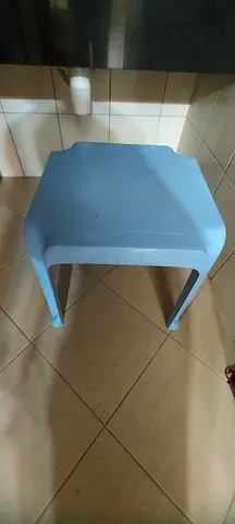Simple light blue plastic stool - compact and sturdy