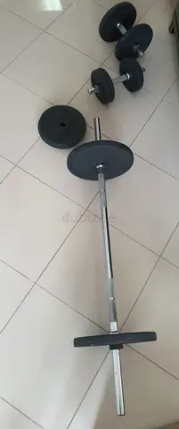 Set of barbell and adjustable dumbbells with weight plates