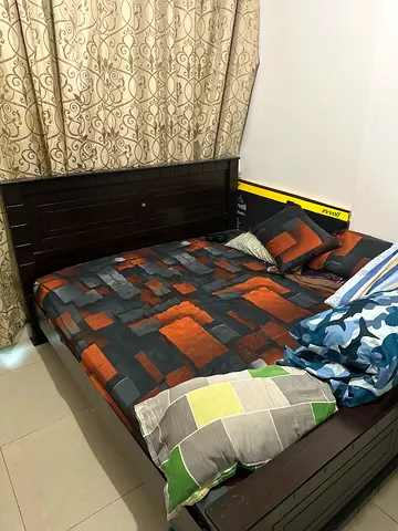 Dark Wood Bed with High Headboard