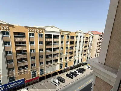 Brand new building - 1 BR apartment - balcony - Coverd parking - close to muwailah park