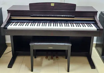 The Yamaha Clavinova CLP-330 is an 88-key digital piano featuring a GH3 (Graded Hammer 3) weighted