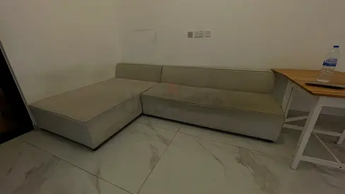 L-shaped light grey fabric corner sofa (2-seater with chaise) - good condition