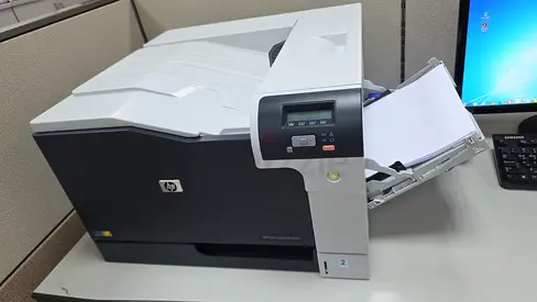 HP Color LaserJet Enterprise Printer - Working Office Printer and its new cartridge worth aed 900