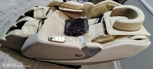 Full-body beige electric massage chair in good condition