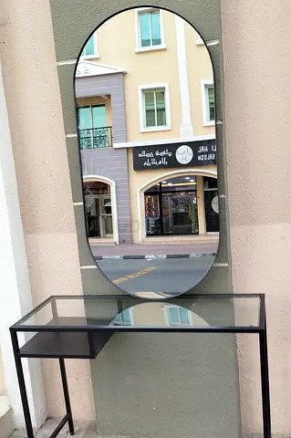 Slim Black Metal Console Table with Glass Top and Oval Mirror