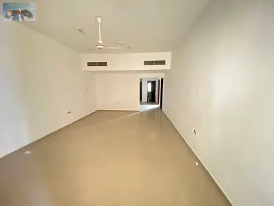 Private parking with a master bedroom with a balcony and large built-in wardrobes.
