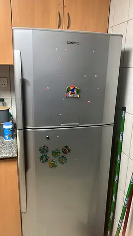 Silver double-door refrigerator in good working condition