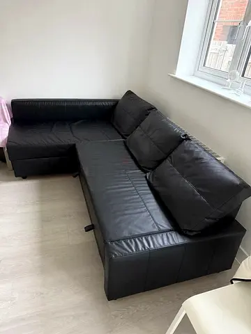 Black L-shaped Faux Leather Sofa-bed with storage - Good Condition